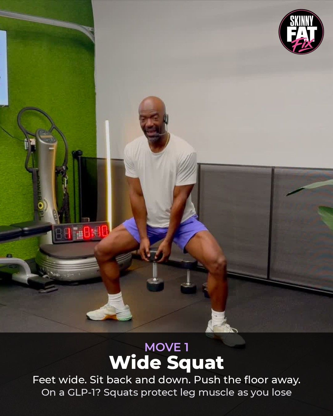 Coach RJ demonstrating the wide squat with a dumbbell